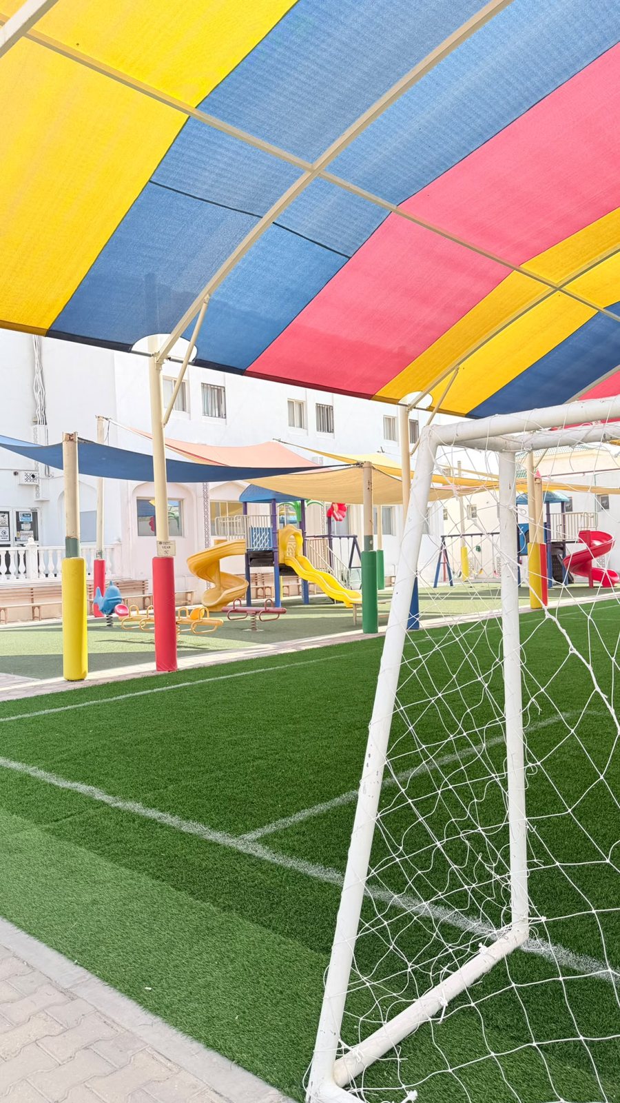 The sports pitch under its shade canopy