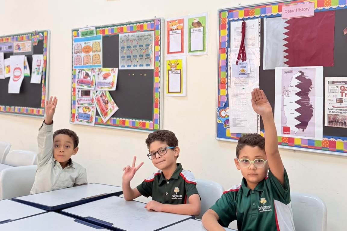 Primary students working together with their teacher